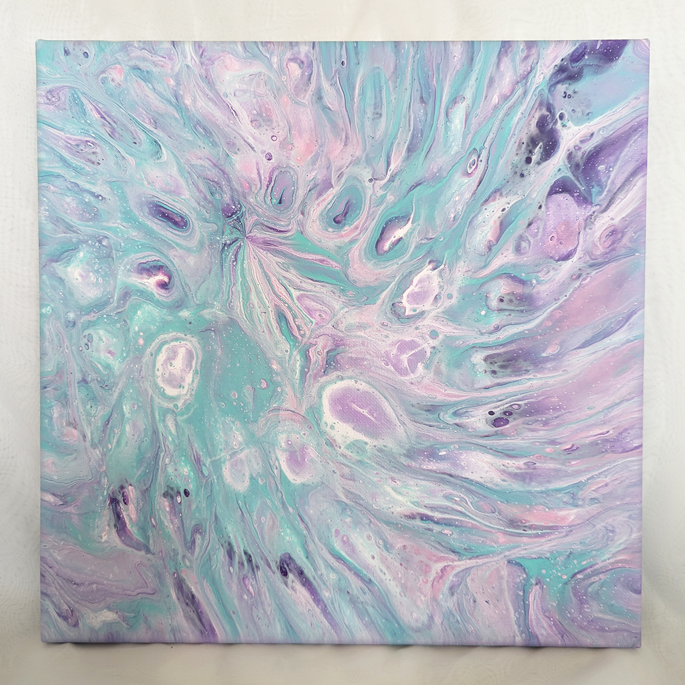 Abstract painting in pastel colors of green, purple, white, and pink.